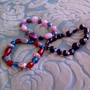 A trio of handmade beaded bracelets.